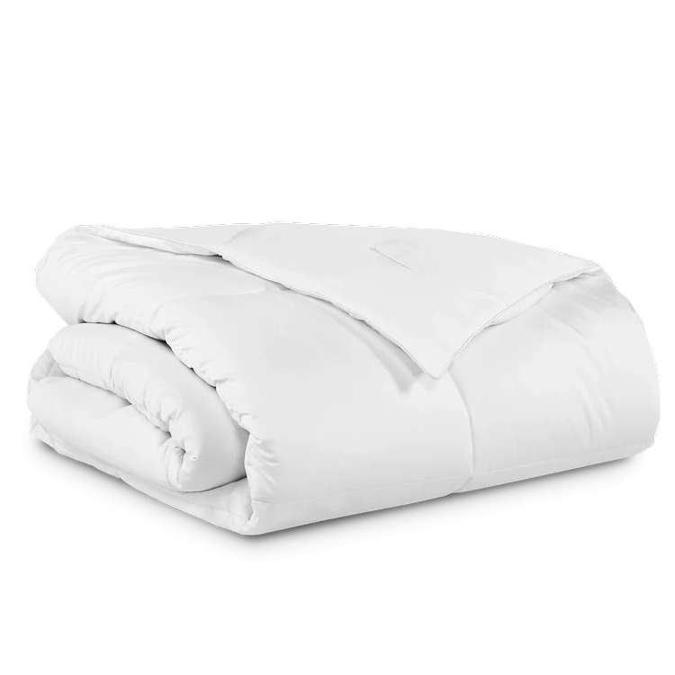 A neatly folded white comforter with a pillow on top.